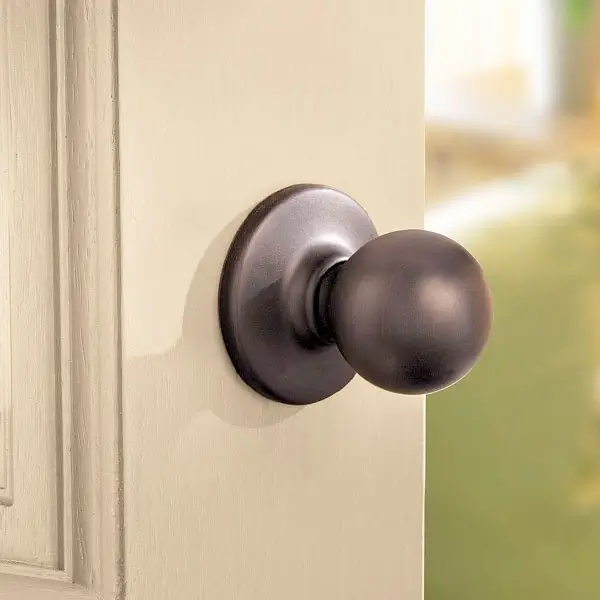 Elegant bedroom door with a classic Elysian knob.